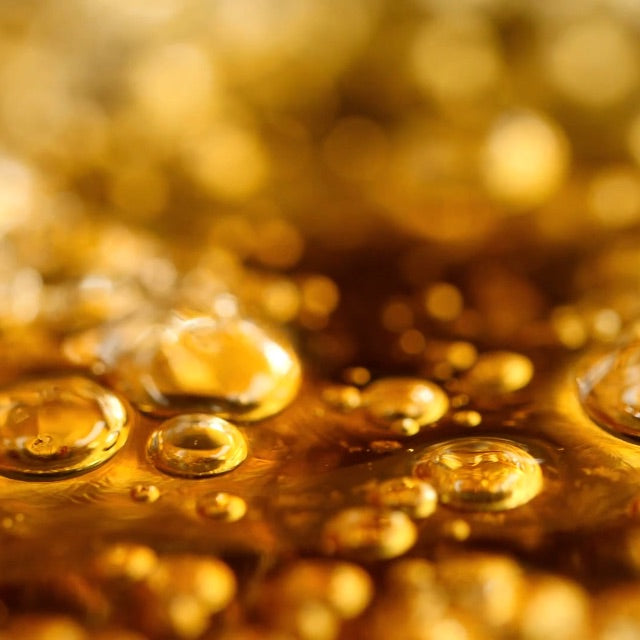 close up of bubbling golden liquid