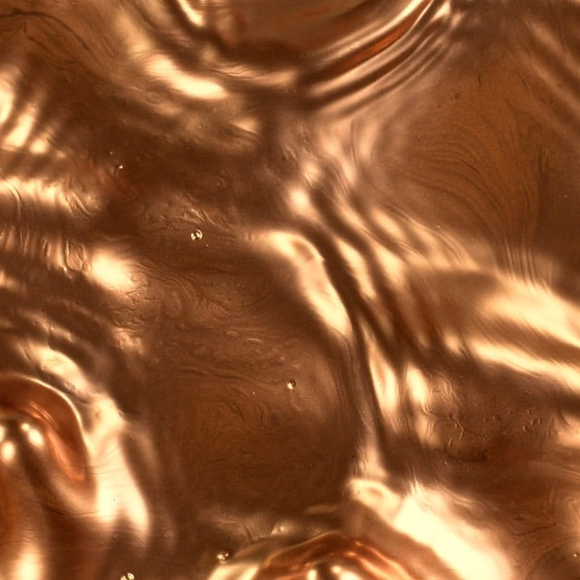 shimmering bronze liquid surface