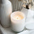 white lit candle and tabletop decoration