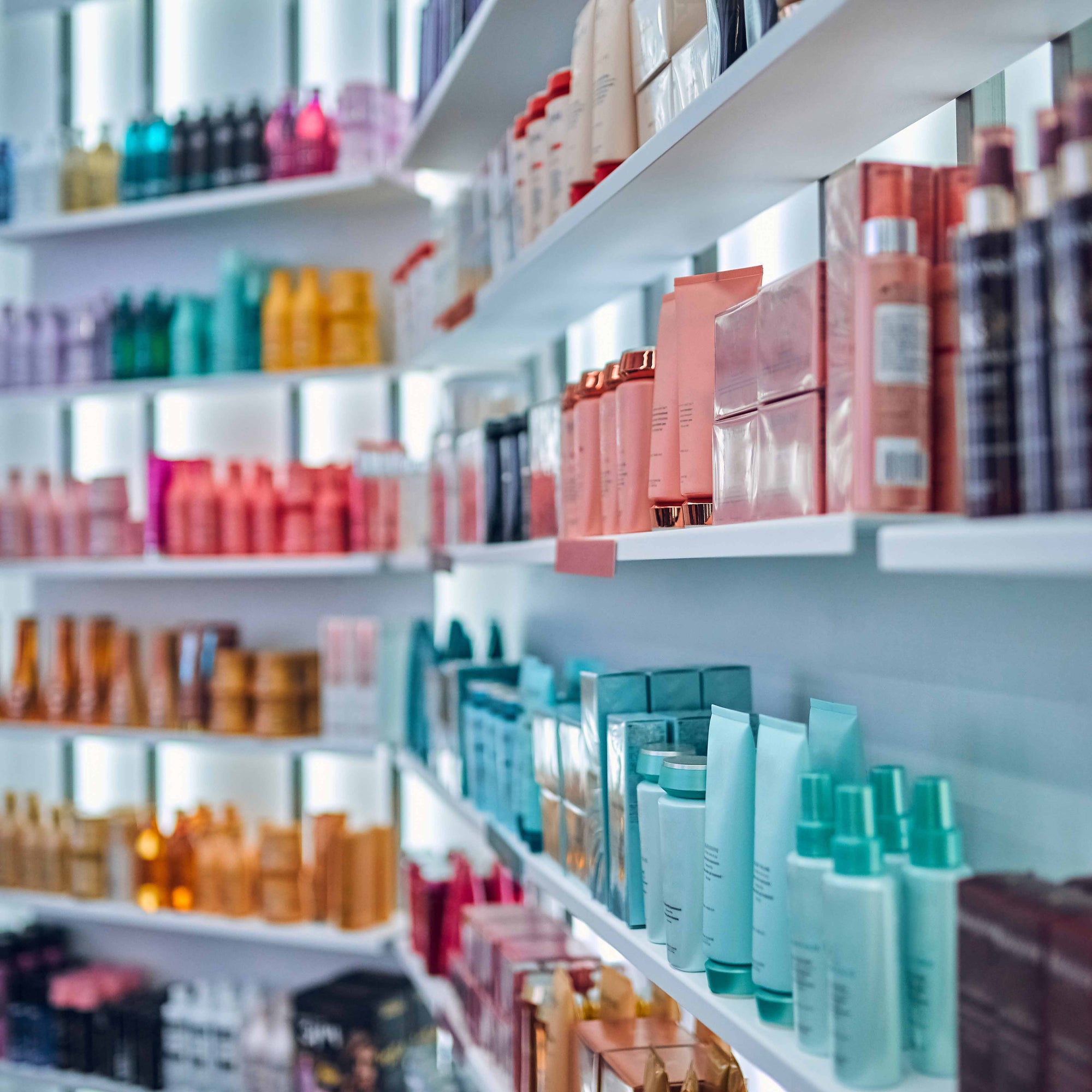 beauty products on a shelf in retail store